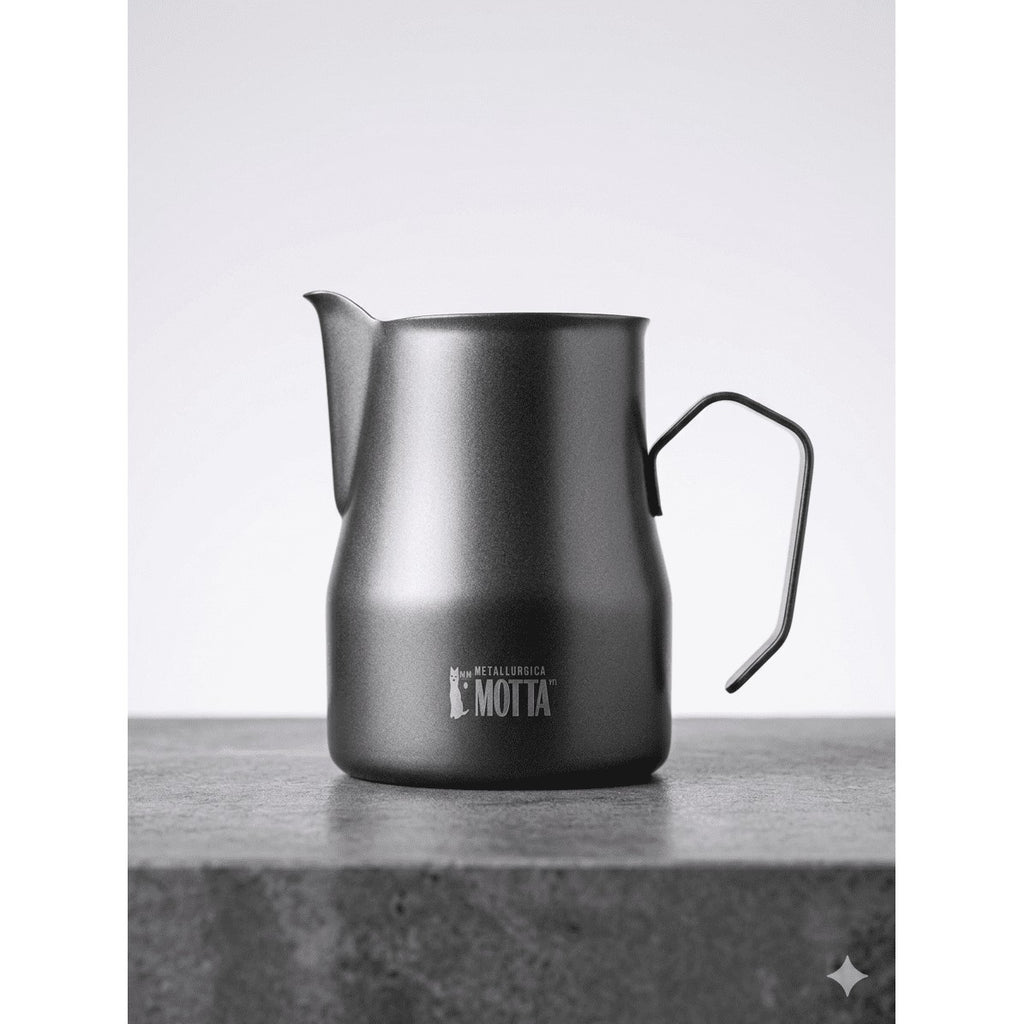 Dark Motta 350ml stainless steel milk pitcher on a stone surface