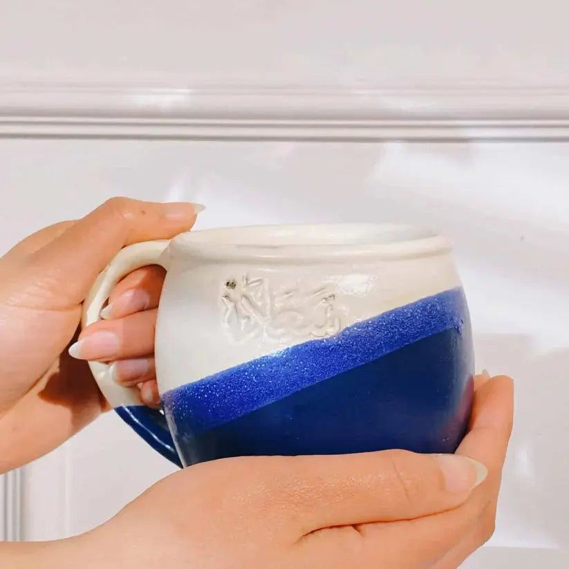Order Handmade Pottery Coffee Mug - Saada Blue & White for LE 445.00 at Coffee & Cream, All your coffee needs in one place. Shop Coffee, Beans, Ground Coffee, Instant Coffee, Creamers, Coffee Machines, Blenders, and more. 50+ Brands Monin, Lavazza, Starbu