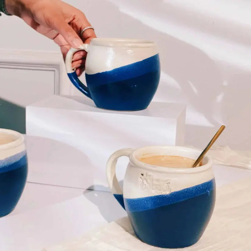 Order Handmade Pottery Coffee Mug - Saada Blue & White for LE 445.00 at Coffee & Cream, All your coffee needs in one place. Shop Coffee, Beans, Ground Coffee, Instant Coffee, Creamers, Coffee Machines, Blenders, and more. 50+ Brands Monin, Lavazza, Starbu